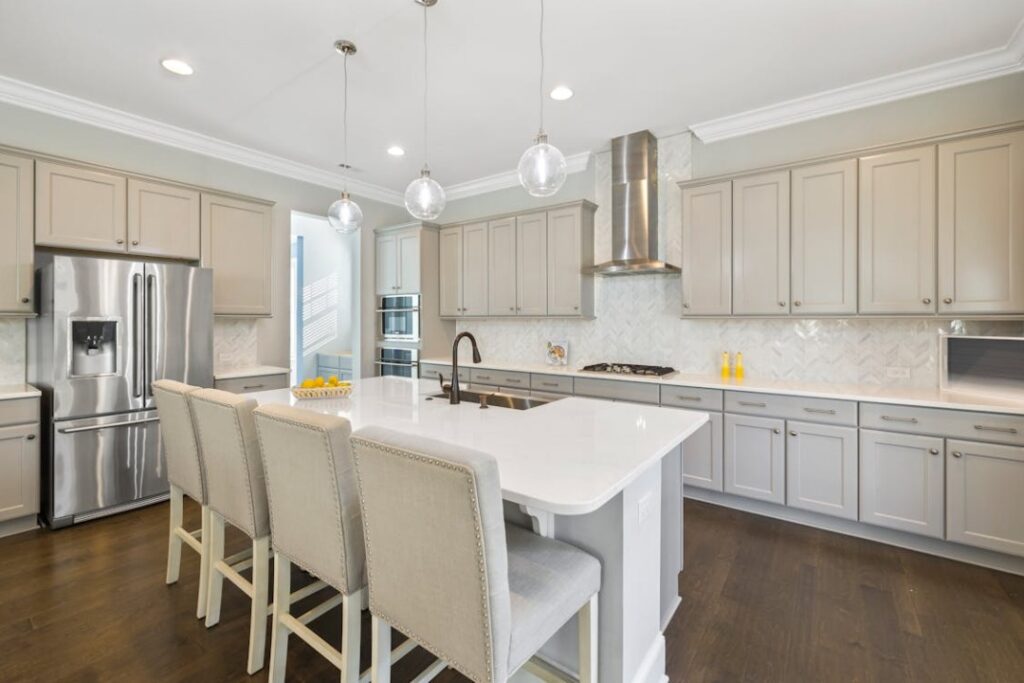 A kicthen space with white cabinets.